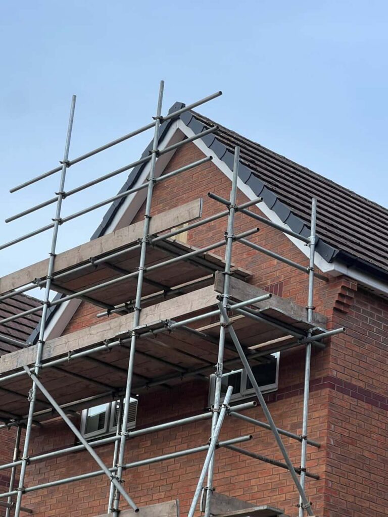 This is a photo of a roof which has just been repaired. There is a scaffold located at the gable end for access onto the roof. Works carried out by Nettleham Roofing Repairs